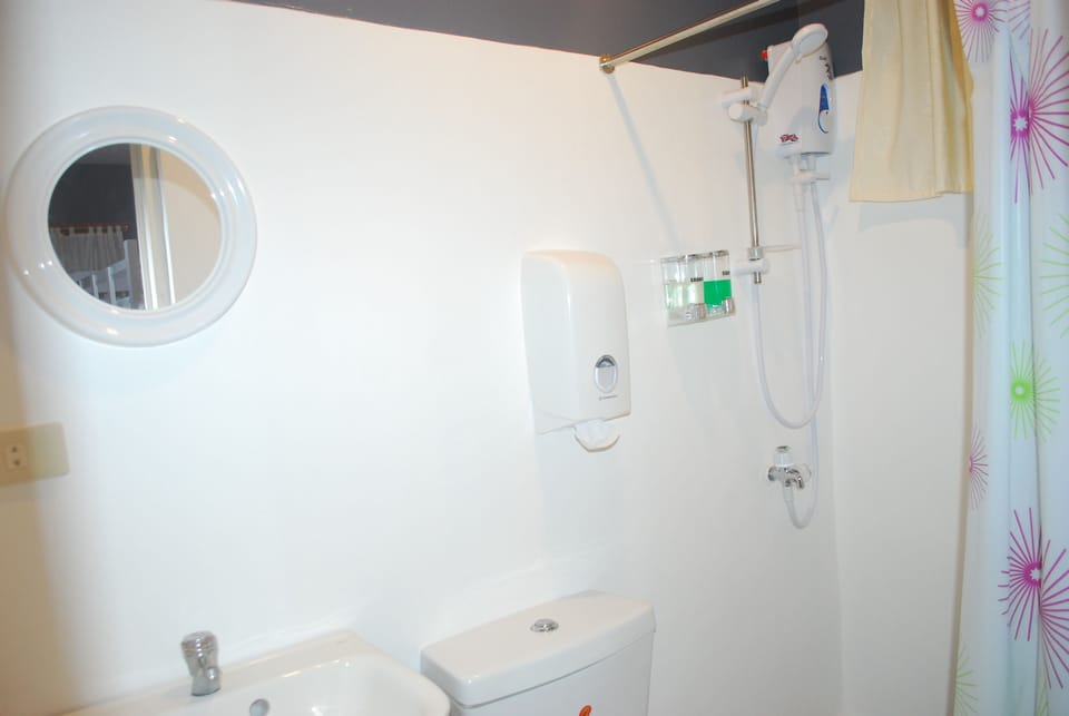 Shower, rainfall showerhead, bidet, towels