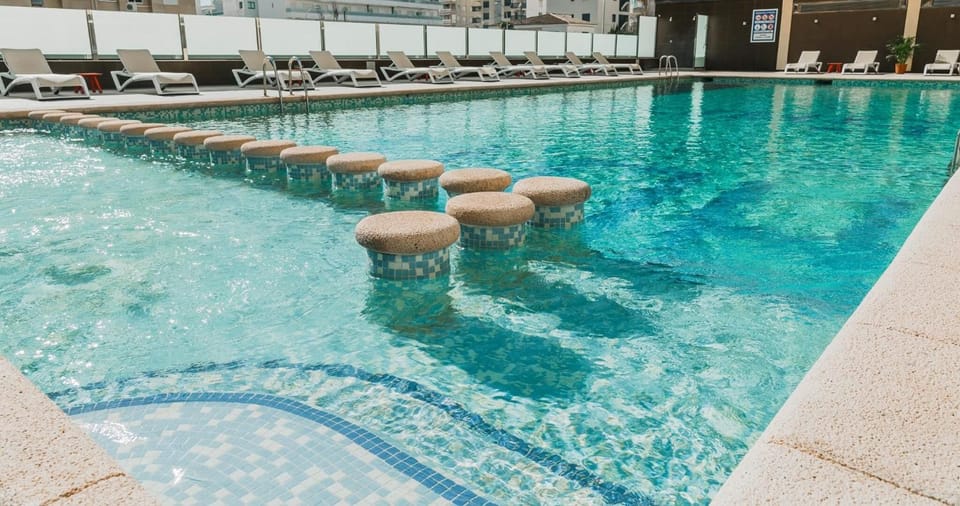 Seasonal outdoor pool, open 9:30 AM to 9:00 PM, pool umbrellas