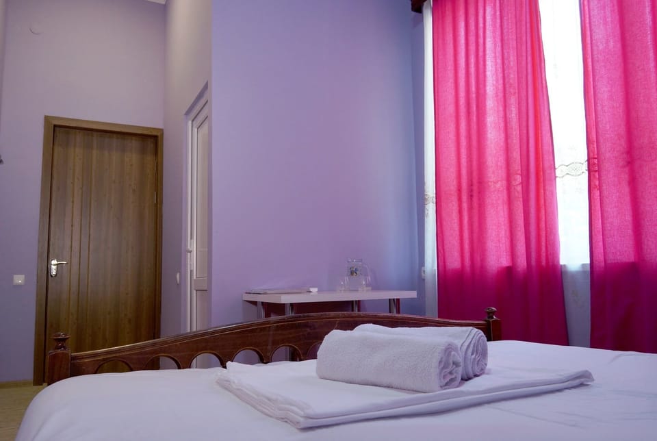 Deluxe Room | Minibar, desk, laptop workspace, blackout drapes
