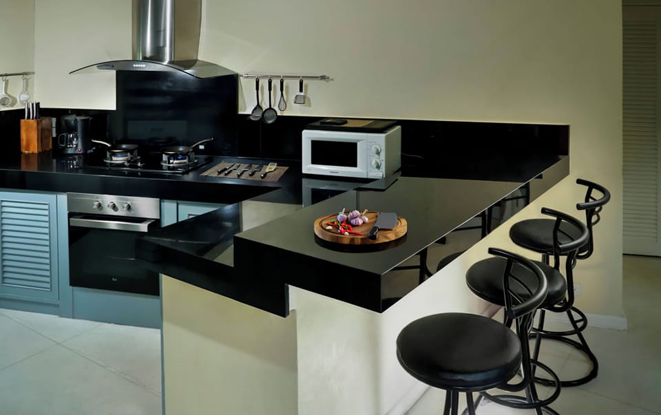Fully fitted kitchen with oven, microwave fridge, freezer etc and breakfast bar