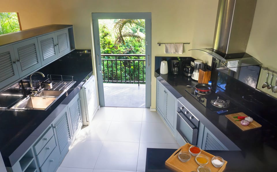 Kitchen with oven, hob, microwave, kettle, toaster etc with lovely balcony