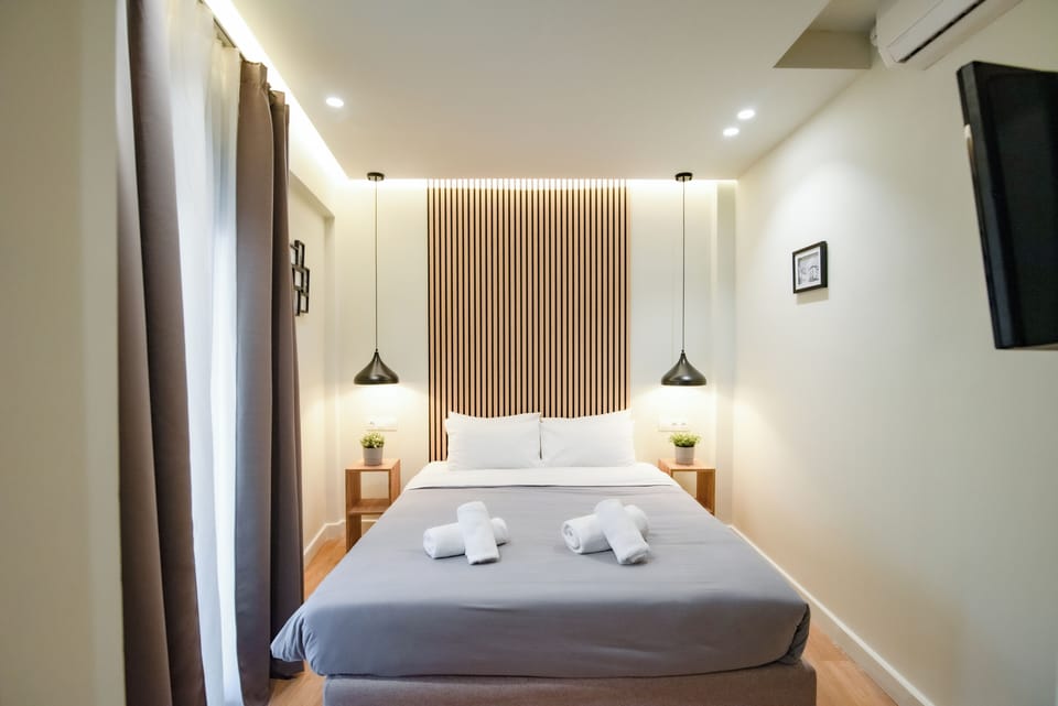 Premium Penthouse | Down comforters, desk, laptop workspace, blackout drapes