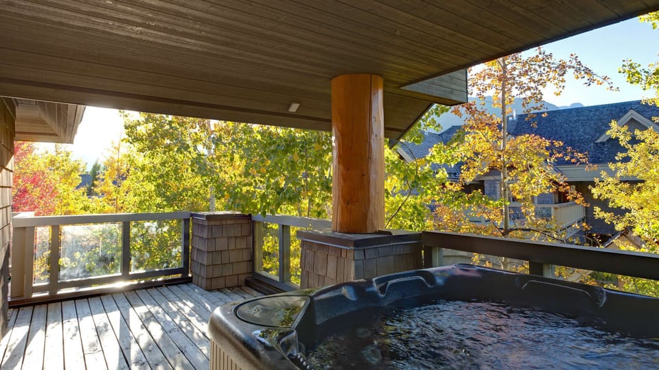 - Private hot tub on covered deck with scenic mountain view  
- Perfect for unwinding after a day of skiing or hiking  
- Surrounded by trees and fresh alpine atmosphere  
