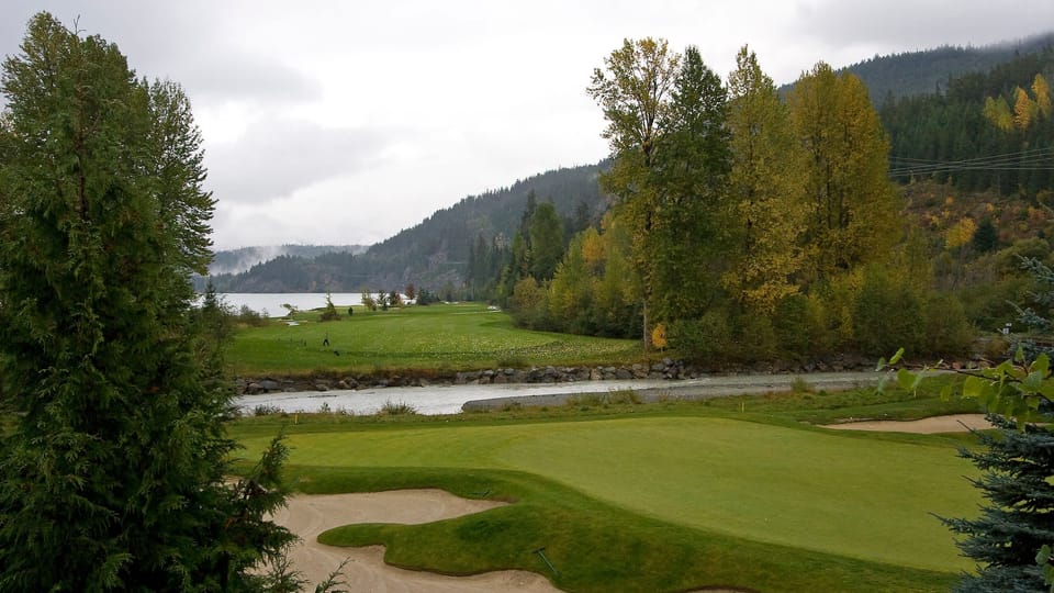 - Scenic golf course view surrounded by trees and mountains  
- Peaceful landscape with river and rolling green hills  
- Perfect backdrop for relaxing mornings and evening strolls  