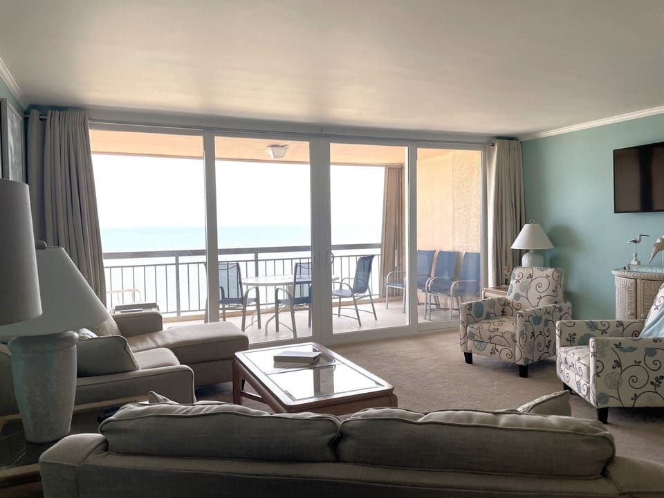 Full ocean view from the living area, dining room, and kitchen.