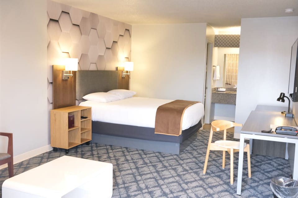 Design Studio | Premium bedding, desk, laptop workspace, blackout drapes