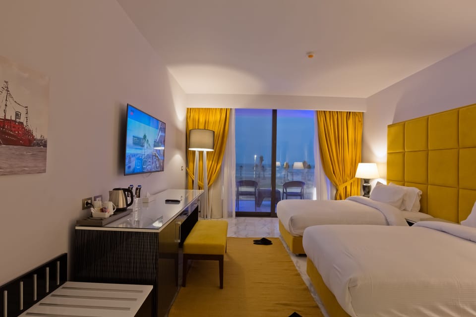 Standard Double or Twin Room, Sea View | Minibar, in-room safe, blackout drapes, soundproofing