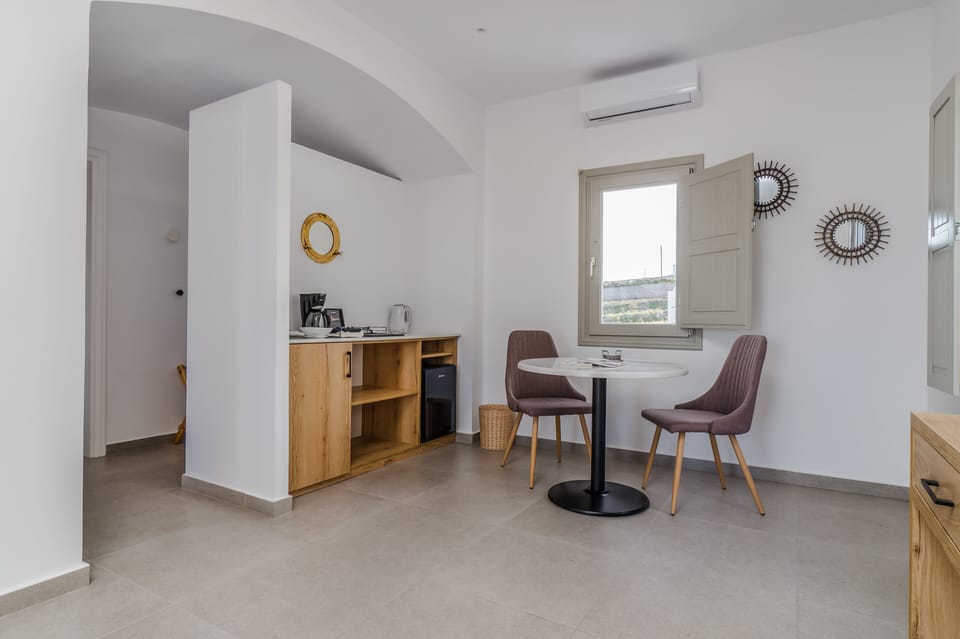 Iphigenia Suite with Hot Tub | Living area | 32-inch Smart TV with satellite channels, TV