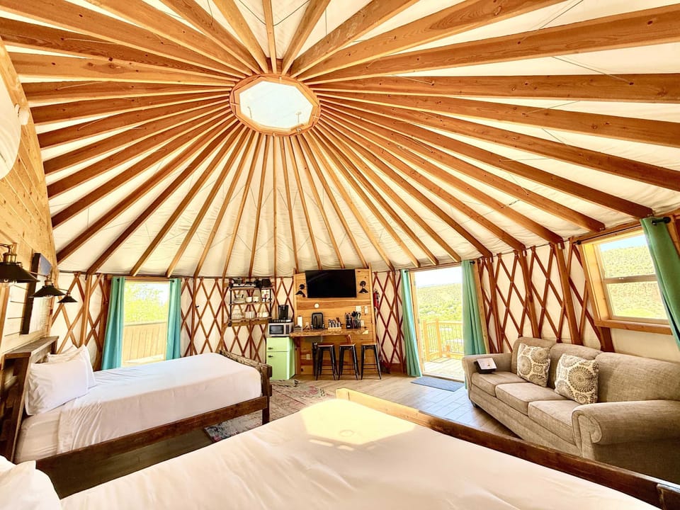 Yurt 10 has 2 king beds, heating & air conditioning, flat screen tv, a queen pullout, fridge, microwave, private bath and everything else you'd need for a complete glamping experience!