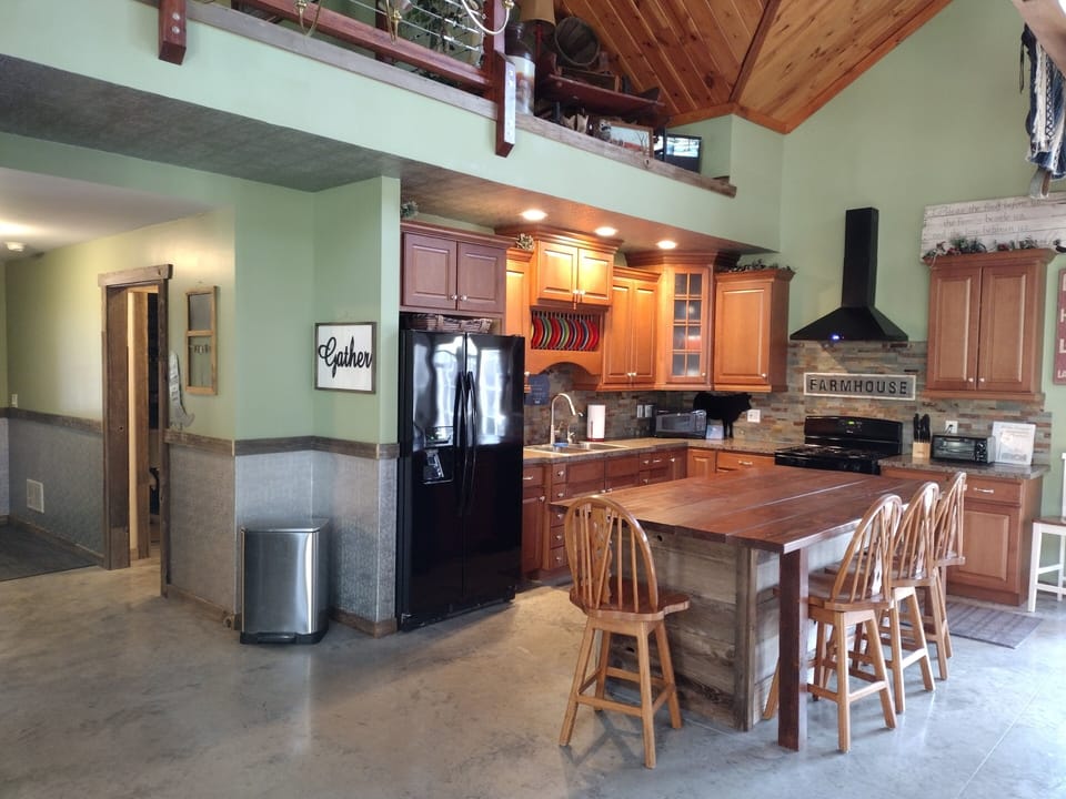 Kitchen and entry from garage with doorway to laundry and half bath.