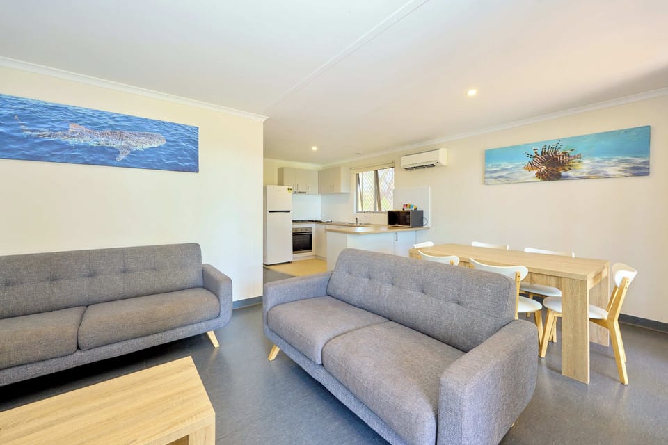  2 Bedrooms Pool View Cabin | Living area | Flat-screen TV