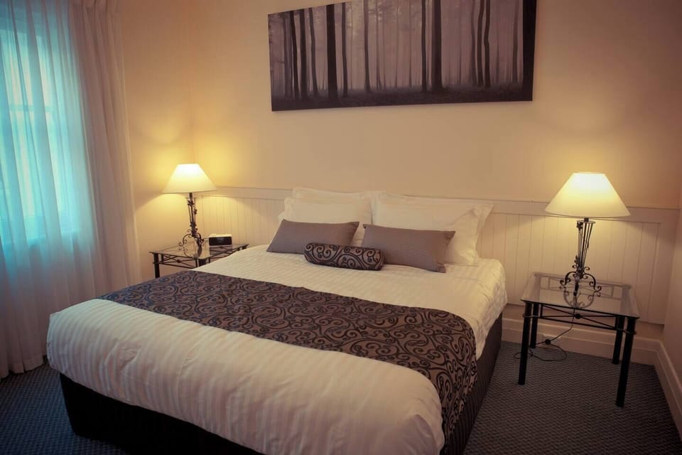 edroom 1: King Bed with luxury bedding and furnishings.
