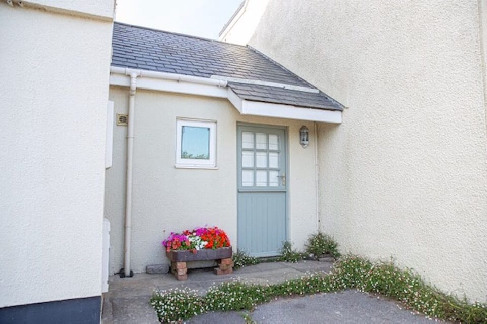 Private front entrance with off road parking space for one car