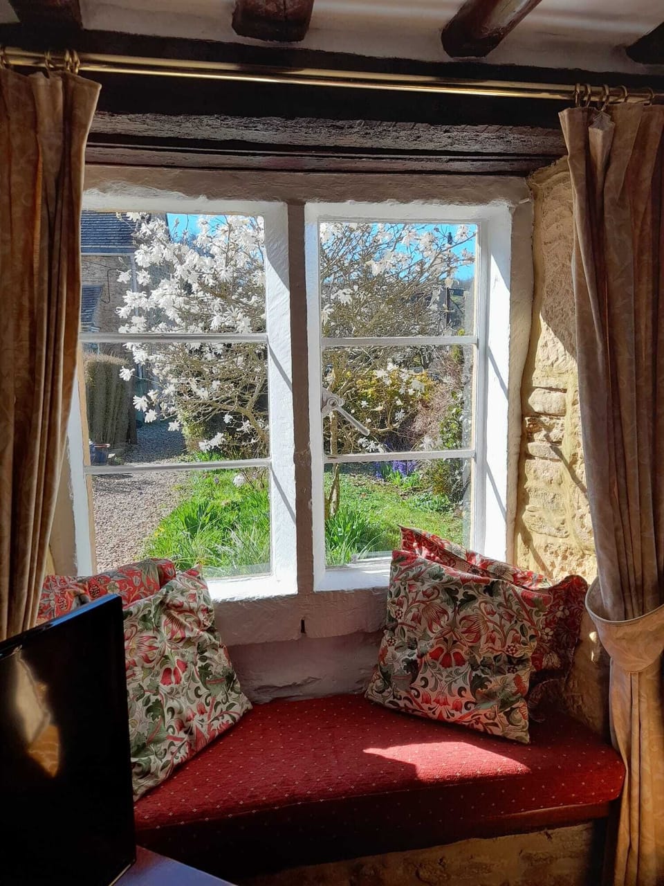 The Mullioned Window Bench  - a great place to curl up with a book