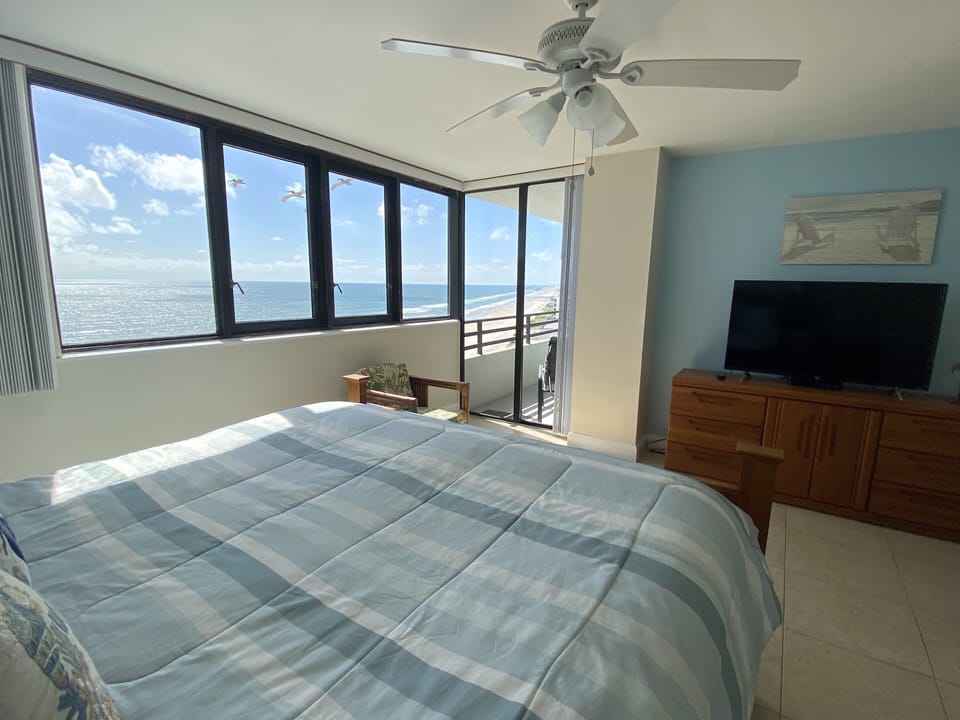 Master bedroom with Ocean  view and access to the balcony. Cal king bed. 50” TV