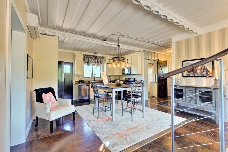 Looking from the spiral staircase into the classy kitchen!