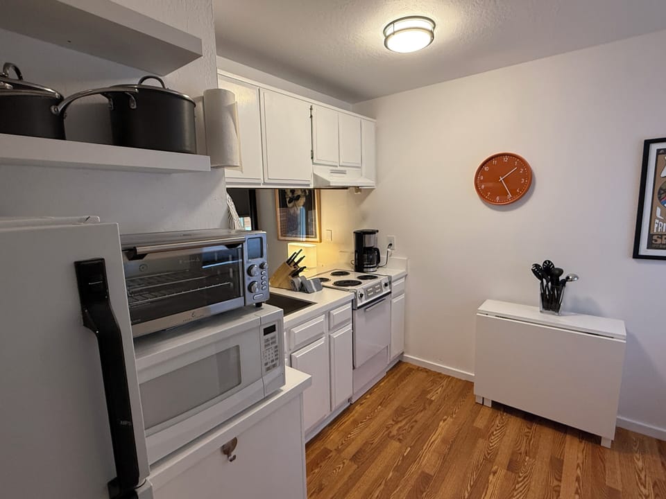 Fully stocked compact kitchen with everything you need for light cooking at home