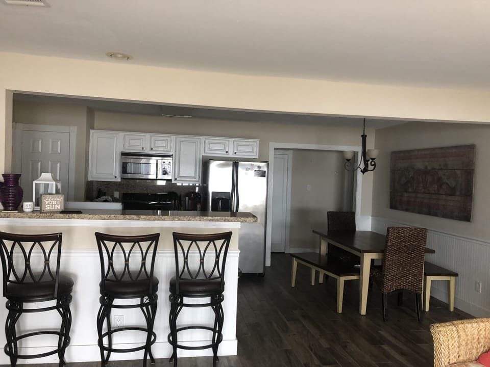 View of the kitchen with brand new stainless steel appliances 