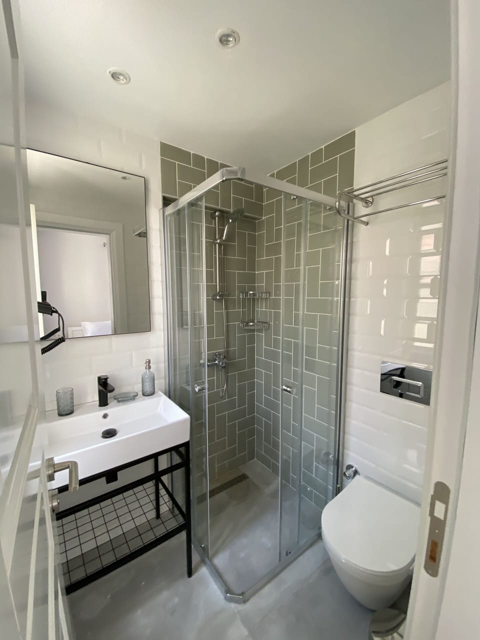 Shower, hair dryer, slippers, towels