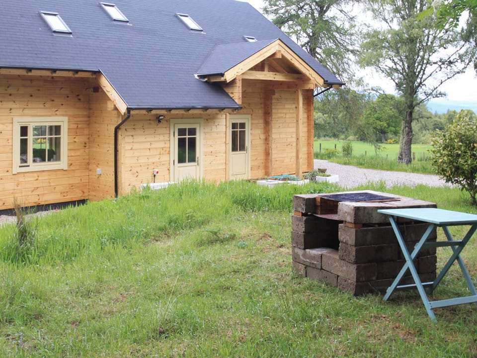 Garden area with BBQ | Moonshine Cottage, Culbokie, near Dingwall