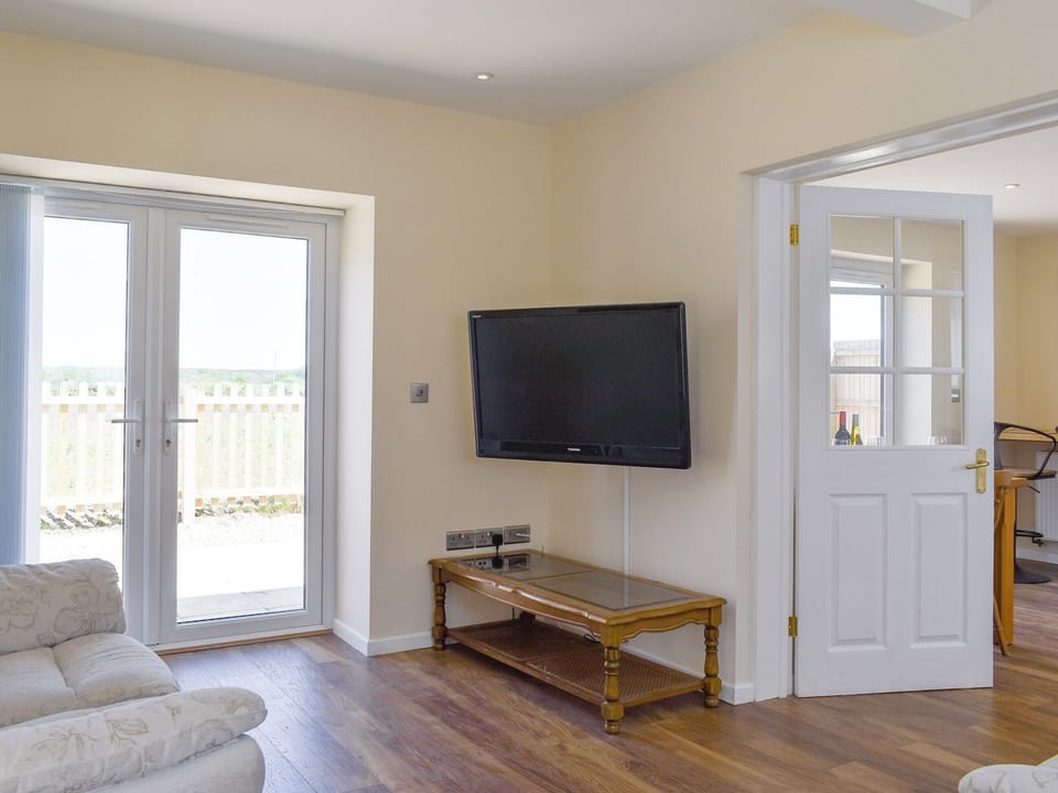 Spacious living area with French doors to patio area | Stars Cottage, Moreton, near Wareham