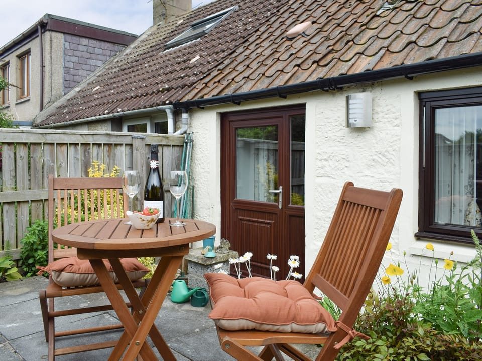 Patio area at rear of property | Horseshoe Cottage, Freuchie, near Cupar