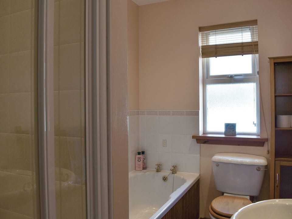 Bathroom with bath and shower cubicle | Seashore Retreat, Johnshaven, near Montrose