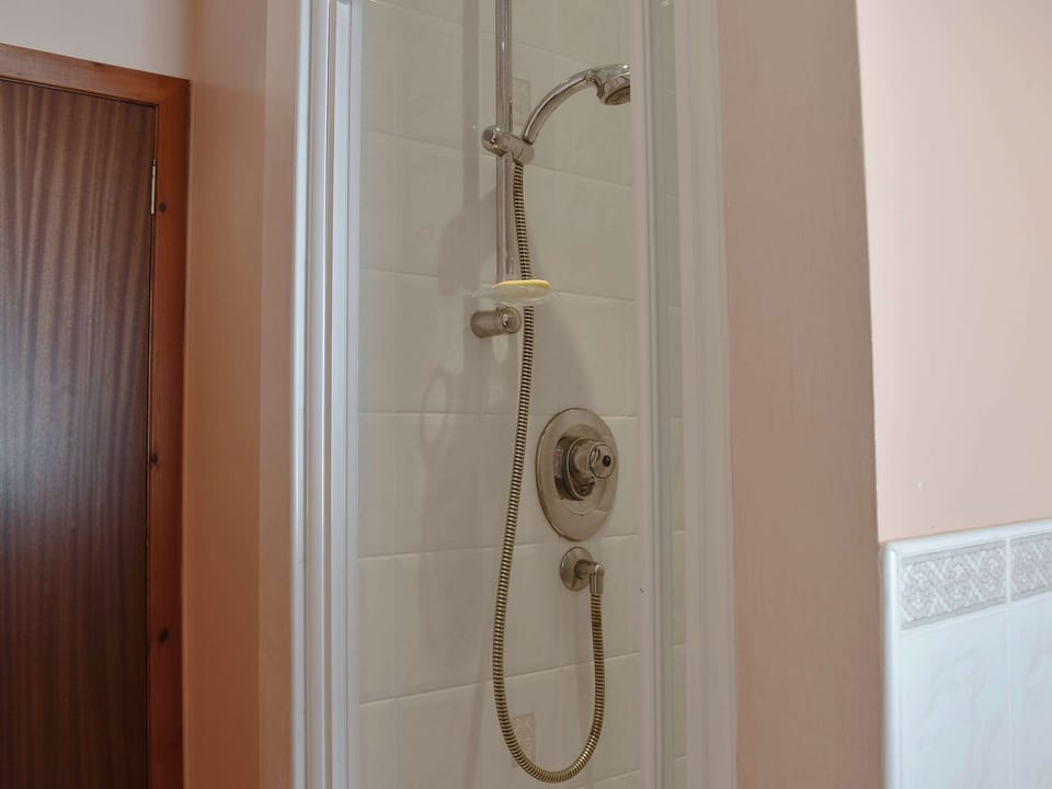 Bathroom with bath and shower cubicle | Seashore Retreat, Johnshaven, near Montrose