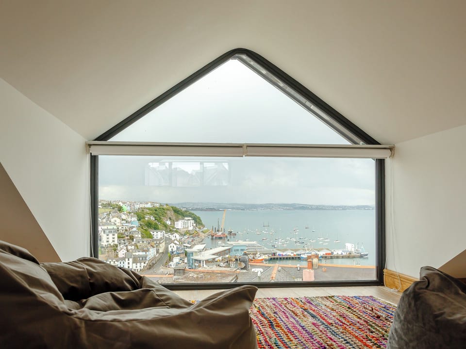 Picture window within the master bedroom | Wrens Perch, Brixham