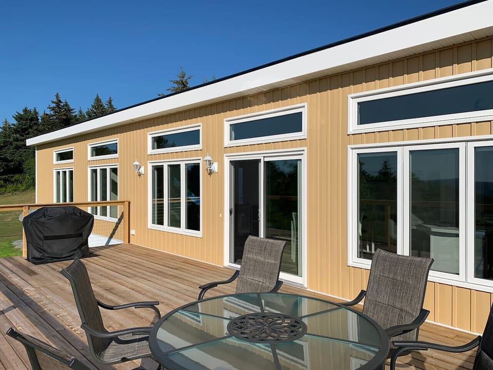 This 4.5 star fully equipped vacation home has  ocean views from every room and a fabulous sundeck for outdoor dining and sunset watching