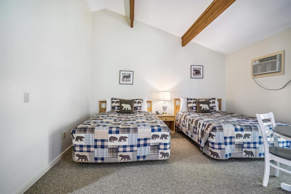 This bedroom offers 2 Queen beds.