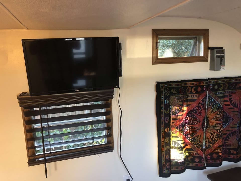 The Happy Hippy Haven camper has wifi TV, power, heat and lights for comfort. No other