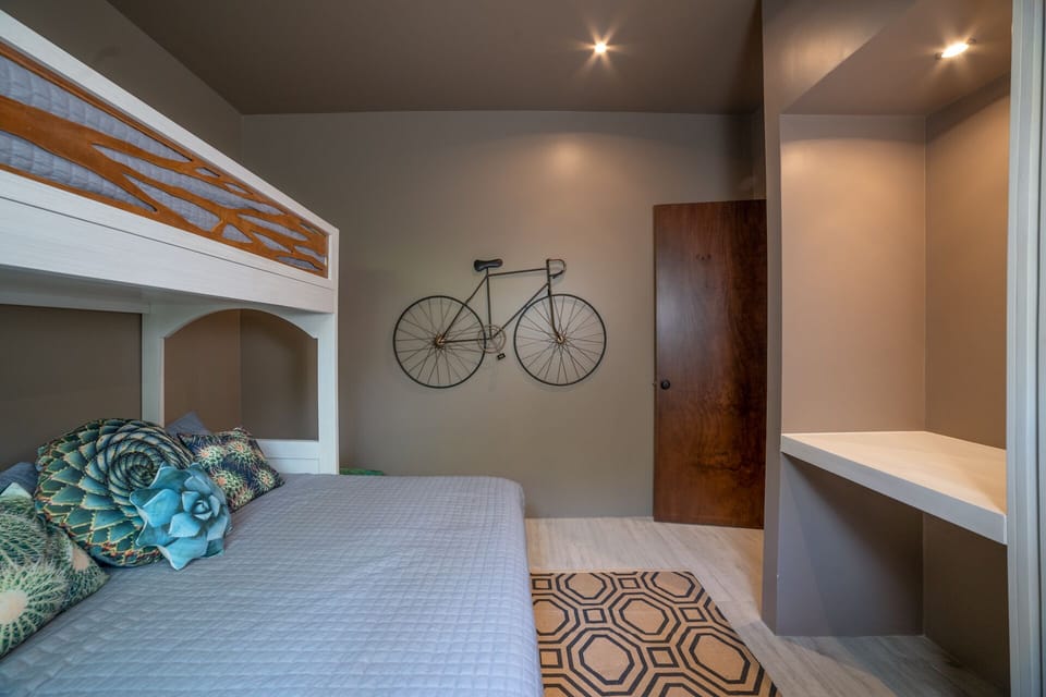 #4 The bunk arrangement adds a playful touch to the room, perfect for the young at heart or those seeking a unique sleeping experience.