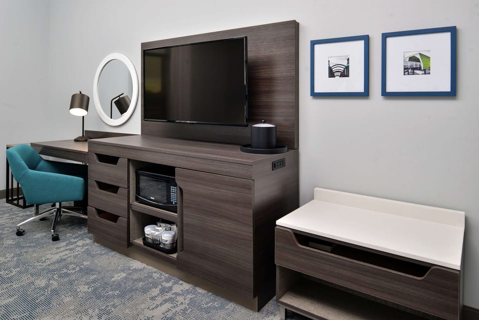 Desk, laptop workspace, blackout drapes, iron/ironing board