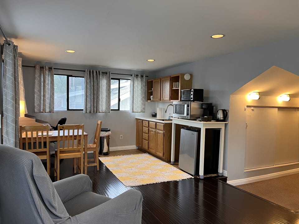 The couch (behind), a comfy chair and the kitchenette make up the main area.