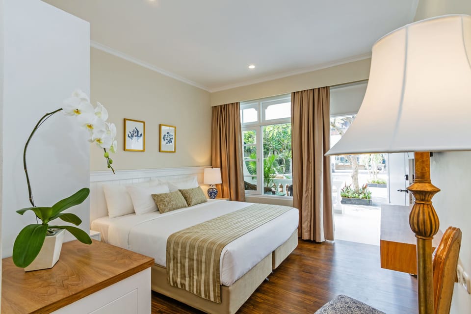 Deluxe Room, Terrace, Pool View | Minibar, in-room safe, desk, laptop workspace