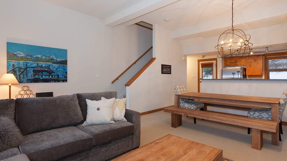 - Open-plan living and dining area with rustic wood accents  
- Comfortable space ideal for relaxing or hosting with friends  
- Warm mountain charm meets contemporary design  
