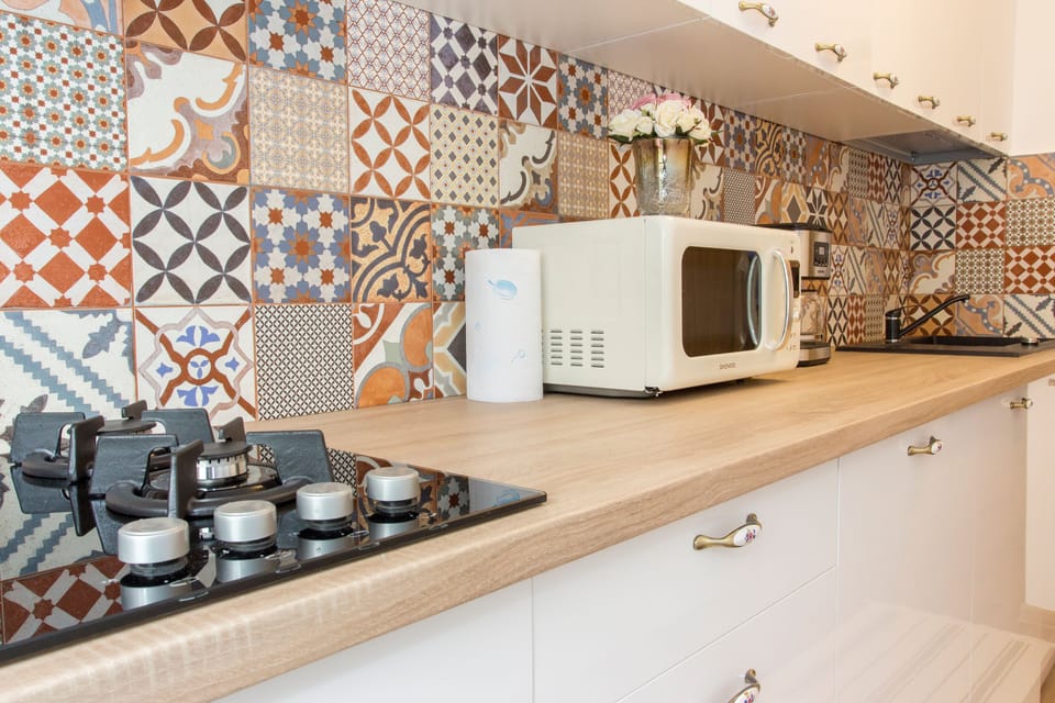 Premium Apartment, Balcony, City View | Private kitchen | Full-size fridge, microwave, stovetop, coffee/tea maker