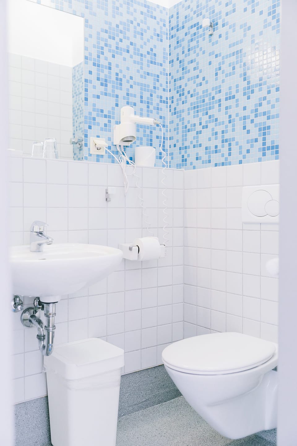 Shower, hair dryer, towels, toilet paper