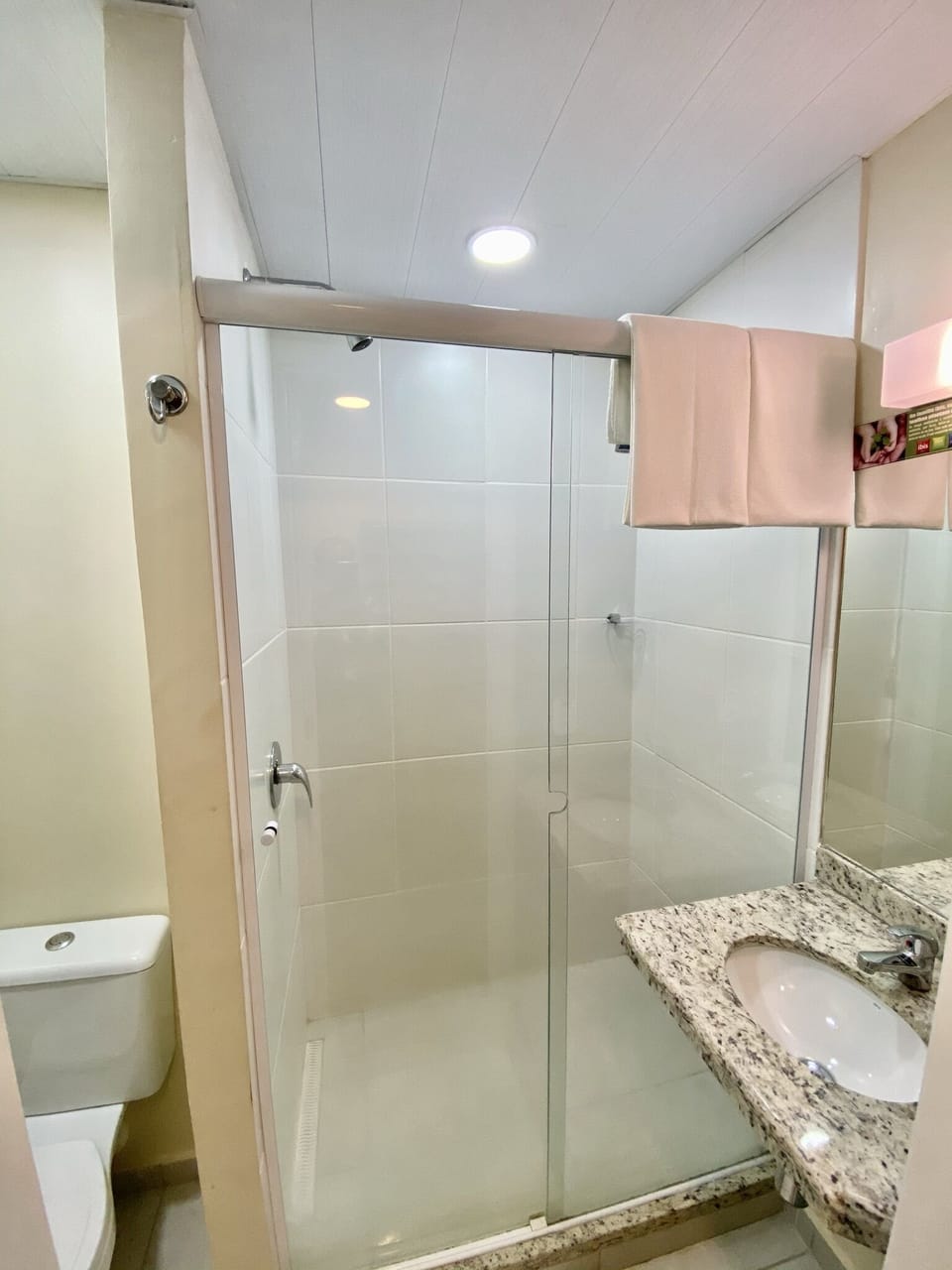 Shower, eco-friendly toiletries, towels