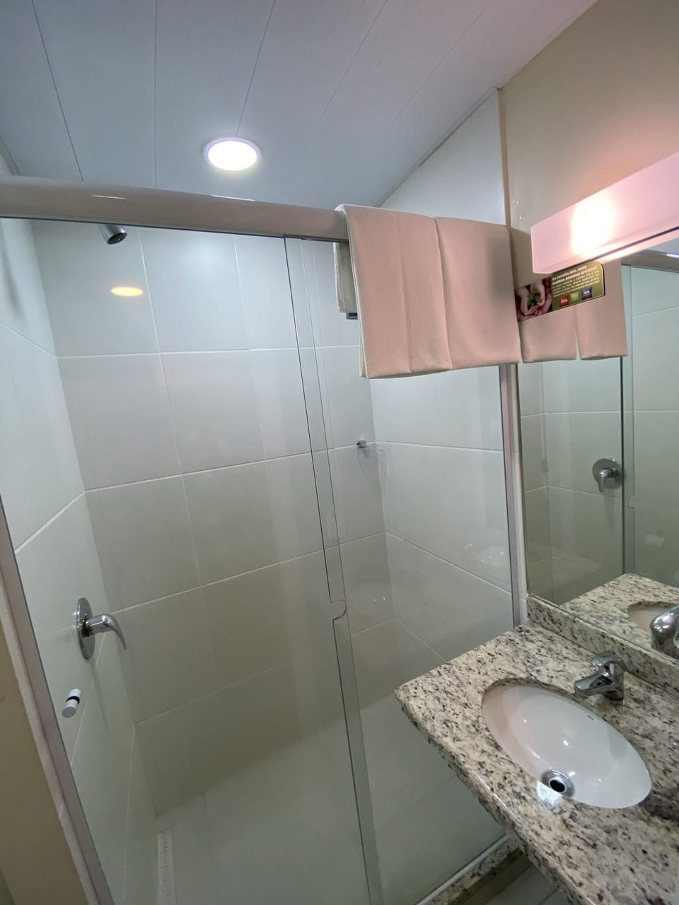 Shower, eco-friendly toiletries, towels