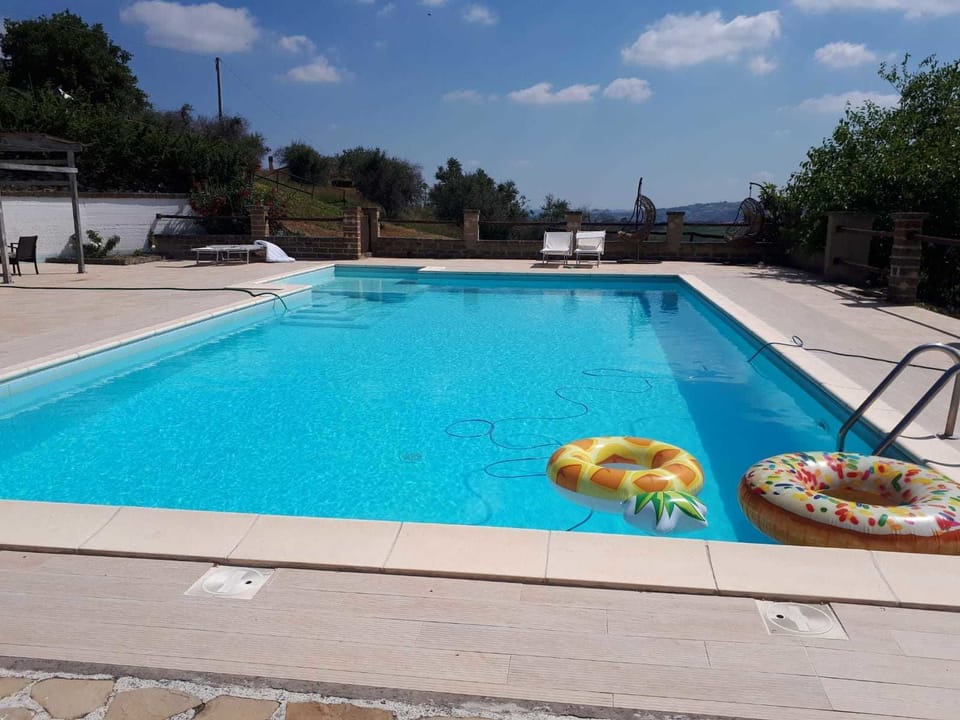 Seasonal outdoor pool, open 8:00 AM to 8:30 PM, pool umbrellas