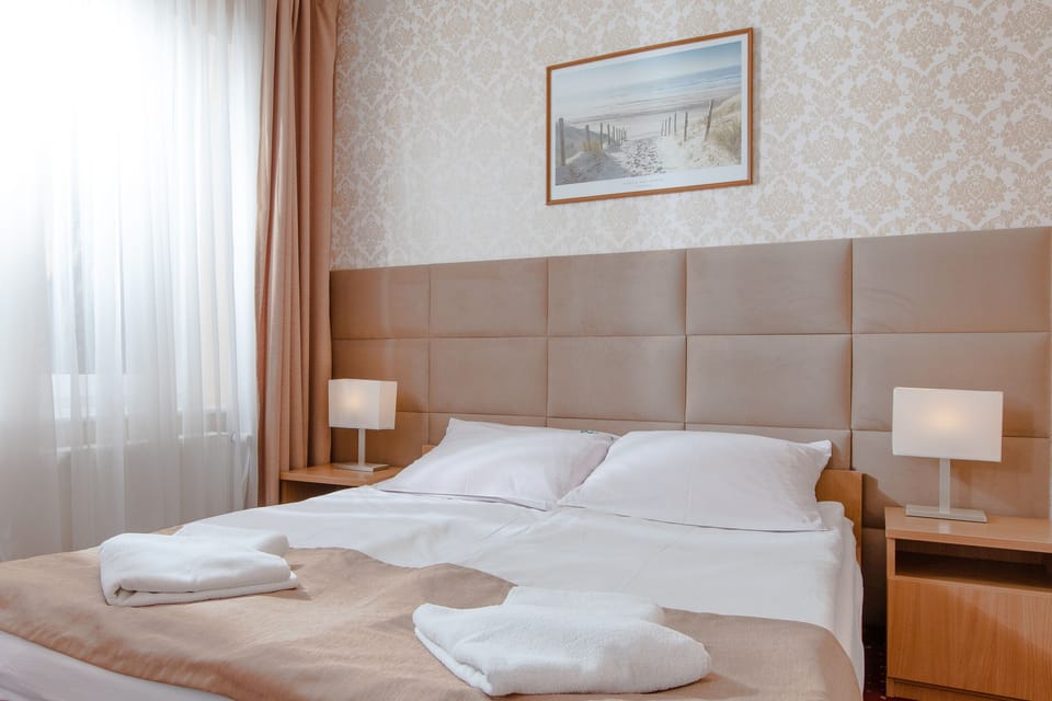 Double or Twin Room | Desk, blackout drapes, rollaway beds, bed sheets