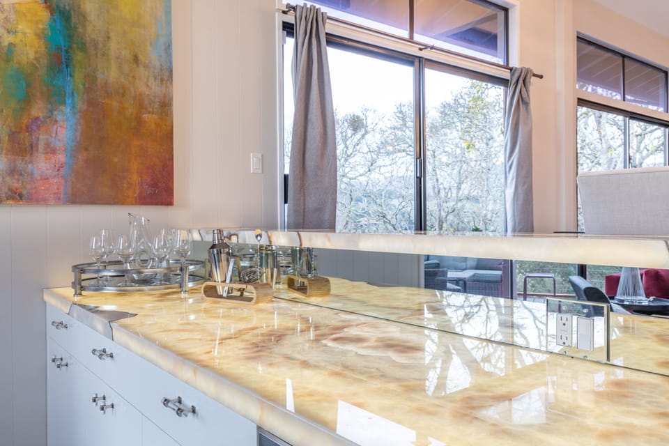 Upstairs Wet Bar, wine fridge.  Beautiful feature bar with backlit Onxy Stone!