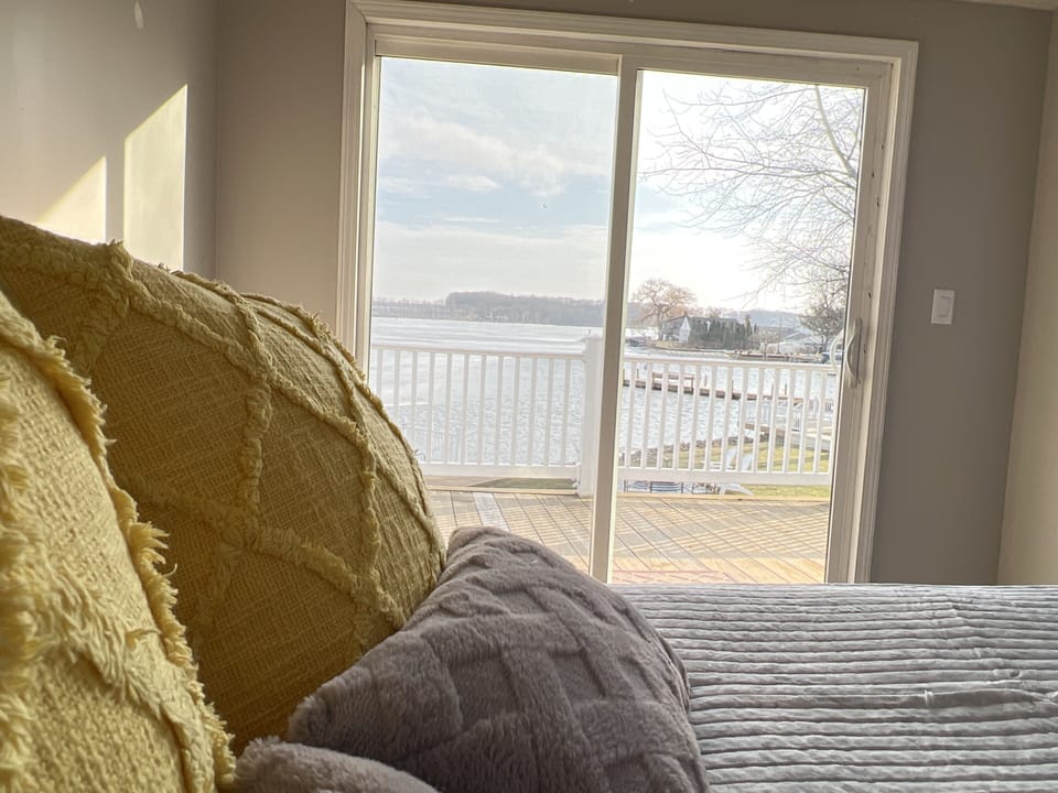 Upstairs Queen bedroom w/ attached bath. Wake up to the breathtaking lake view.