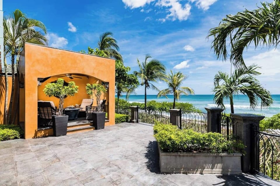 Experience the amazing outdoor spaces of this luxury Tamarindo villa, including tropical gardens, lounging areas, and relaxing corners perfect for enjoying the sun, ocean breeze, and serene surroundings.