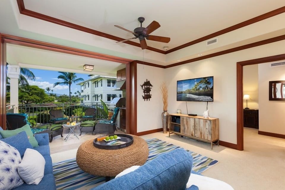 Bright, spacious living room with large sliding doors to covered lanai