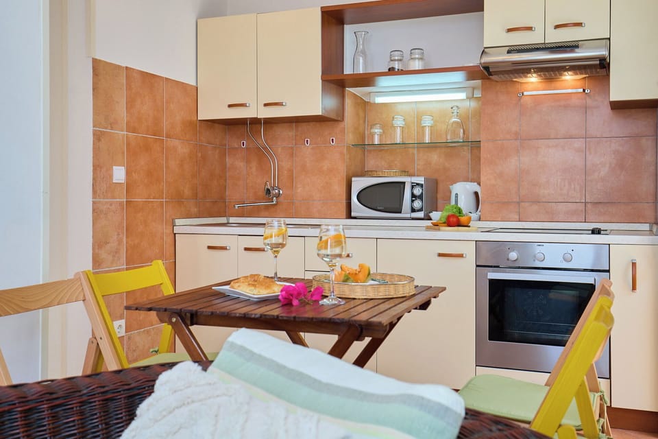 Apartment (2 Bedrooms) | Private kitchen | Coffee/tea maker, full-size fridge, microwave, oven