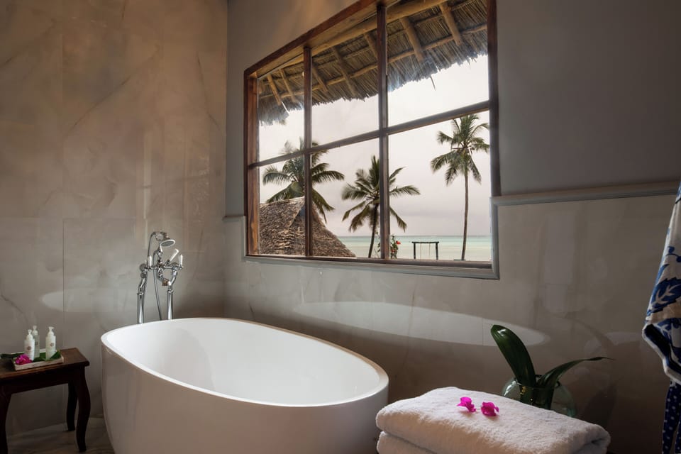 Luxury Studio Suite, 1 King Bed, Balcony, Sea View | Bathroom | Hair dryer, bathrobes, towels, soap