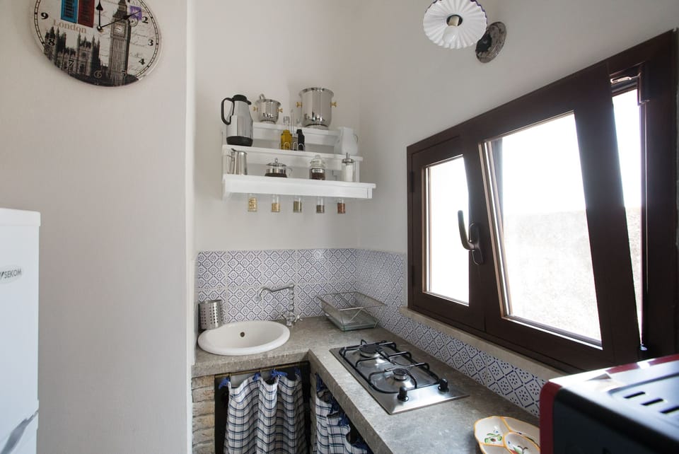 Full-size fridge, stovetop, espresso maker, coffee/tea maker